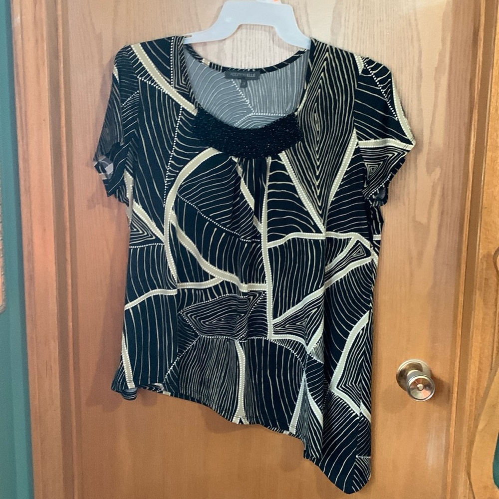 Short sleeve blouse with beeded embellishments on top and handkerchief hem